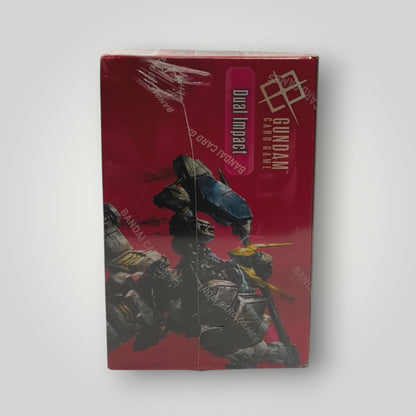 Red Gundam Dual Impact booster box with colorful robot artwork, sealed wrapping visible.