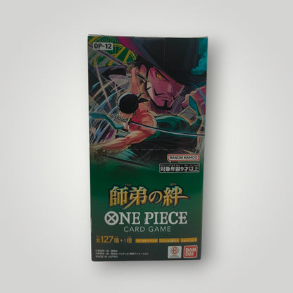 One Piece OP-12 Legacy of the Master Japanese booster box with colorful character art and gold text.
