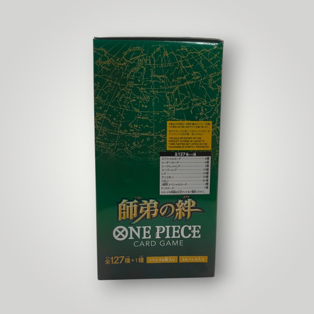 Green One Piece Card Game booster box with gold Japanese text and map design.