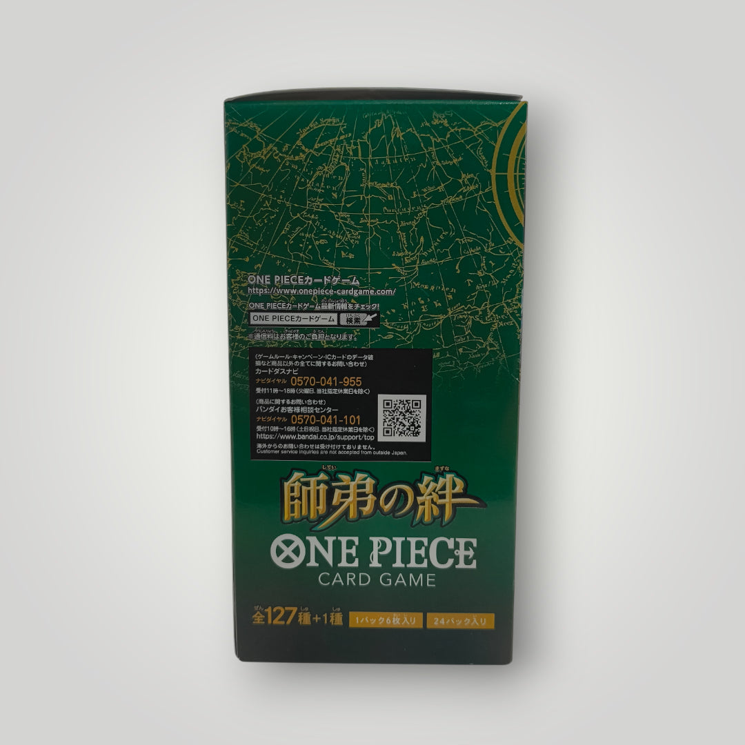 Green and gold OP-12 Legacy of the Master One Piece Card Game booster box with Japanese text and map design.
