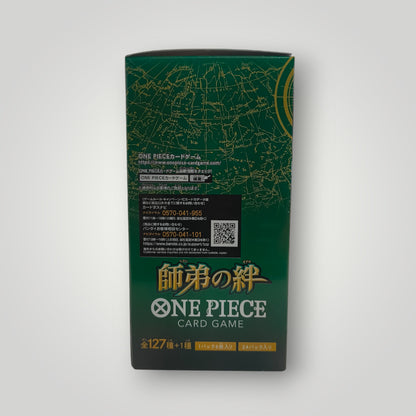 Green and gold OP-12 Legacy of the Master One Piece Card Game booster box with Japanese text and map design.