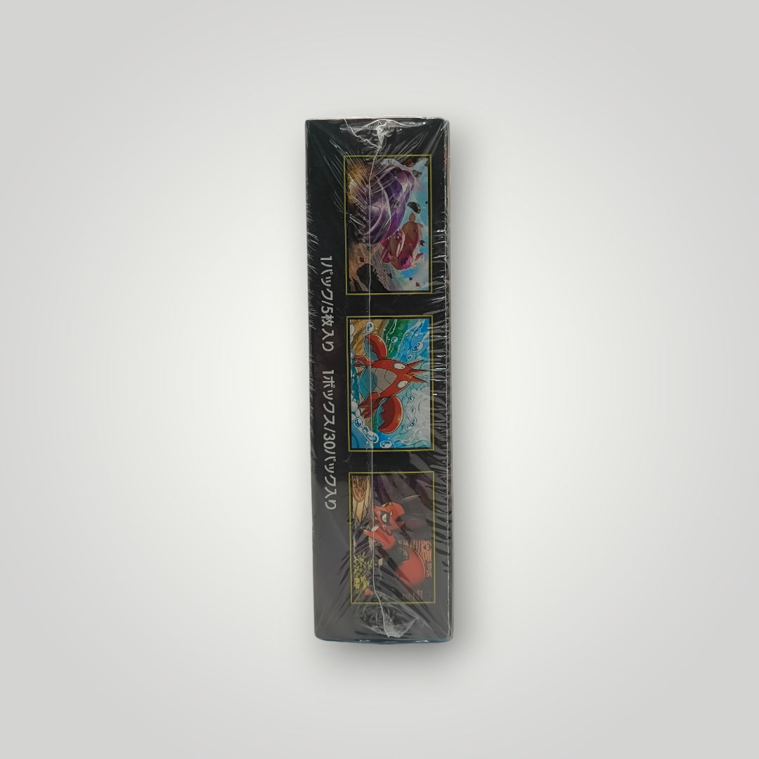 Sealed M1L Mega Brave booster box with Charizard, Garchomp, and Infernape artwork on sides.